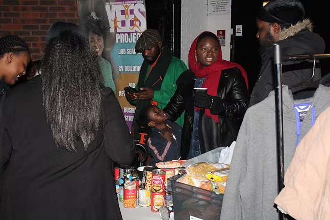 Volunteers at the YEES Project table
